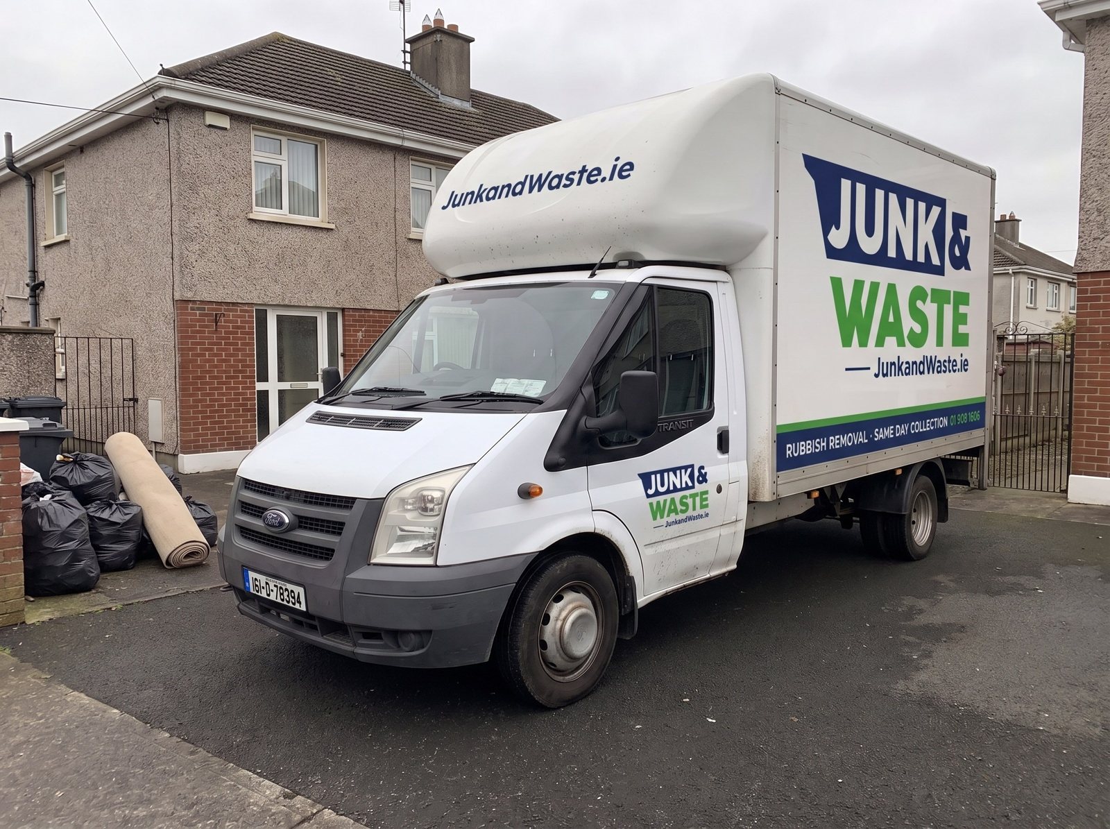Junk & Waste Luton van, reg 161-D-78394, outside a house in Walkinstown with bags and a rolled carpet at the gate